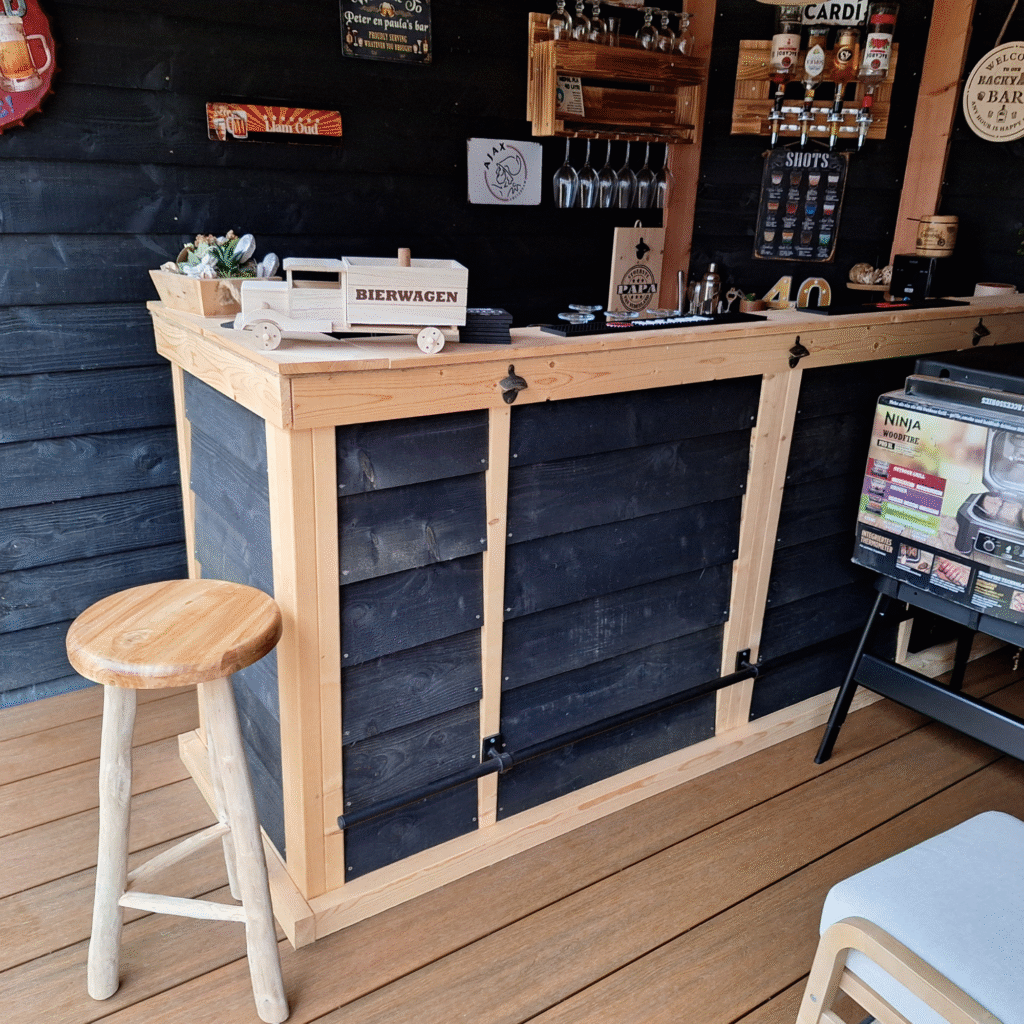 wooden garden shed interior with bar and metal signs